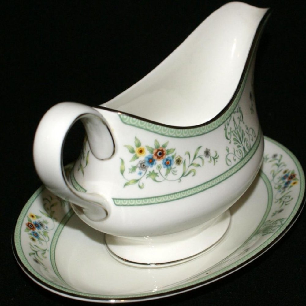 Wedgwood Agincourt Green gravy boat with stand attached.